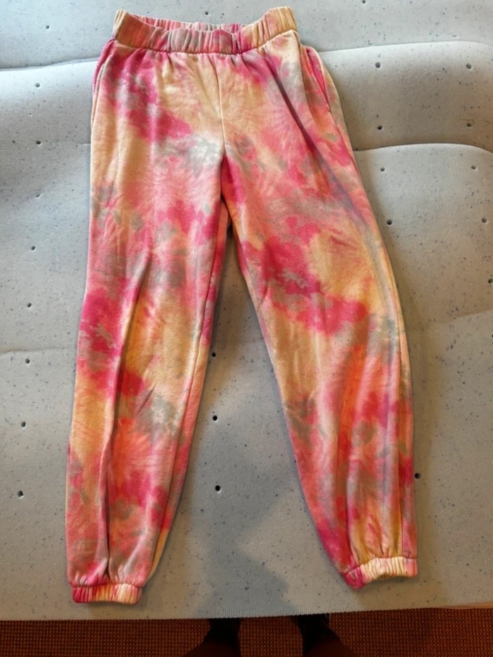 Pink and yellow tie-dye sweatpants